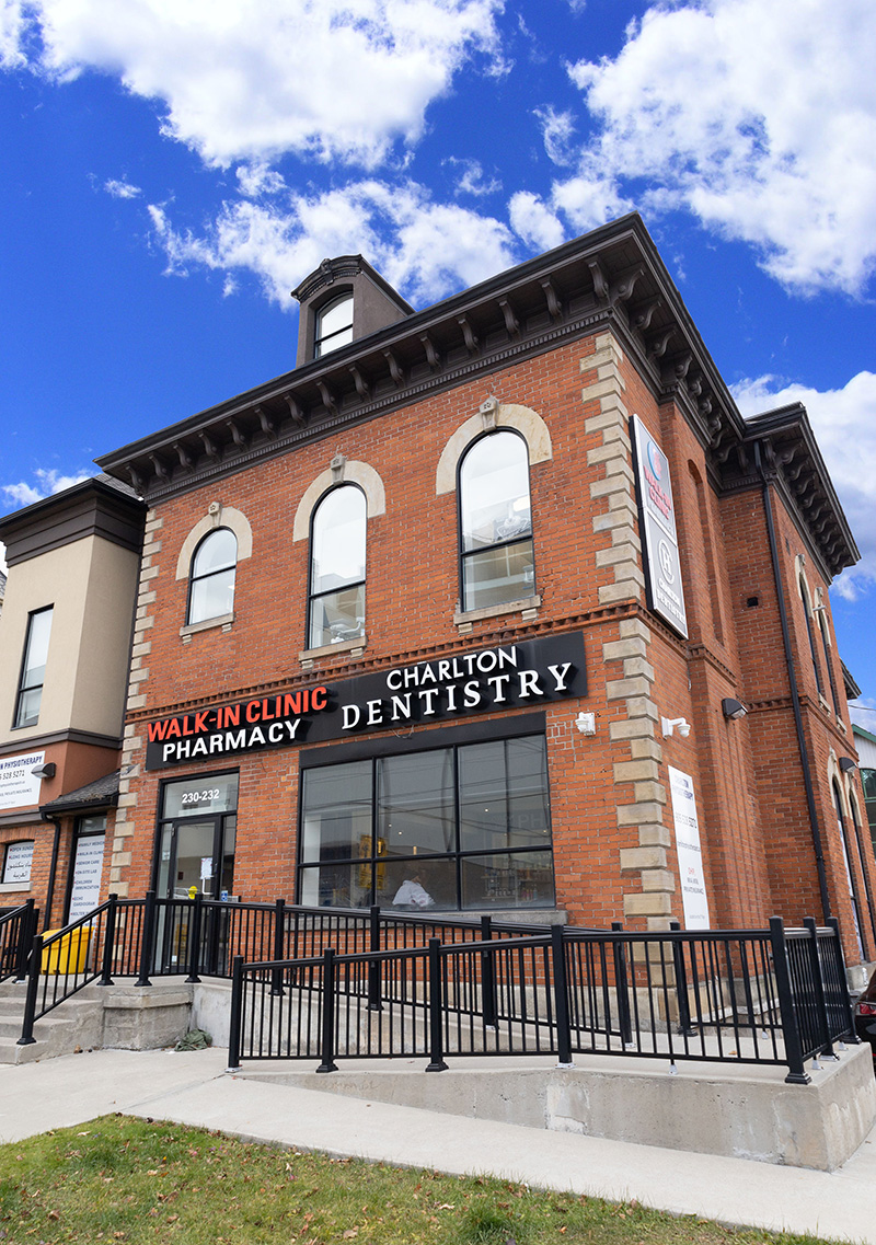 General dentistry Hamilton, exterior of Charlton Dentistry's heritage red-brick building at 230 James Street South in Downtown Hamilton.